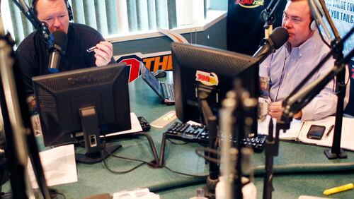 In this November, 22, 2010 photo, Wes Durham (left) and Tony Barnhart (right) talk during a broadcast of their show in the 790 The Zone studios in Buckhead.