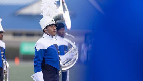 A McEachern band member stands before a GHSA High School football game between Langston Hughes High School and McEachern High School at McEachern High School in Powder Springs, GA., on Friday, August 26, 2022. (Photo by Jenn Finch)