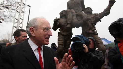 Vince Dooley applauds after a statue of himself was unveiled at a dedication ceremony  for the University of Georgia Vince Dooley Athletic Complex in Athens Saturday Nov. 28, 2008, in Athens.  (Brant Sanderlin/The Atlanta Journal-Constitution/TNS)