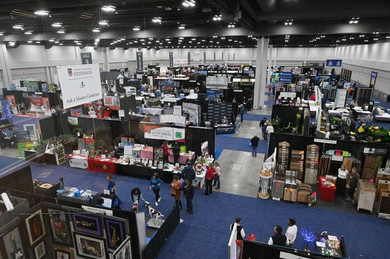 People tour vendors during North Atlanta Home Show at Gas South Convention Center, Friday, Jan. 27, 2023, in Duluth. The older existing convention center space is now being renovated, a full-service hotel is being built on the Gas South district. (Hyosub Shin / Hyosub.Shin@ajc.com)