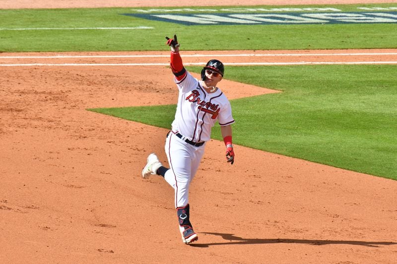 Braves left fielder Joc Pederson (22) celebrates after hitting a three-run home run during the fifth inning of Game 3 of the NLDS Monday, Oct. 11, 2021, at Truist Park in Atlanta. (Hyosub Shin / Hyosub.Shin@ajc.com)