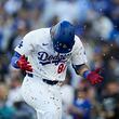 Los Angeles Dodgers' Andy Pages celebrates after hitting a home run during the fourth inning of a baseball game against the Atlanta Braves in Los Angeles, Saturday, May 4, 2024. (AP Photo/Ashley Landis)