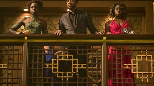 This image released by Disney and Marvel Studios' shows Lupita Nyong'o, from left, Chadwick Boseman and Danai Gurira in a scene from "Black Panther." (Matt Kennedy/Marvel Studios/Disney via AP)