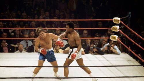 Muhammad Ali delivers a hard right to Jerry Quarry on Oct. 26, 1970, in a scheduled 15 round fight at the Atlanta Municipal Auditorium in Atlanta. Ali was declared the winner after Quarry didn’t answer the bell for the fourth round. Quarry had a gash over his left eye that required 11 stitches to close. (AP Photo/Joe Holloway Jr.)