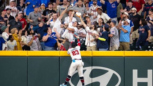 Atlanta Braves outfielder Michael Harris II (23) can't reach a home run hit by the Cubs’ outfielder Seiya Suzuki (27) in the eighth inning at Truist Park on Wednesday, May 15, 2024. Chicago won 7-1. (Arvin Temkar / AJC)