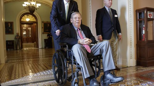 Sen. Johnny Isakson, R-Ga., is wheeled away from the Senate chamber on March 30, 2017. (AP Photo/J. Scott Applewhite)