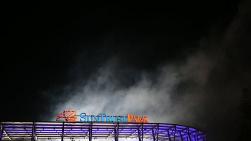 April 14, 2017, Atlanta, Georgia - The fireworks leave a cloud of smoke hovering above the stadium after the Atlanta Braves Opening Game at Suntrust Parkin Cobb County, Georgia, on April 14, 2017. (HENRY TAYLOR / HENRY.TAYLOR@AJC.COM)