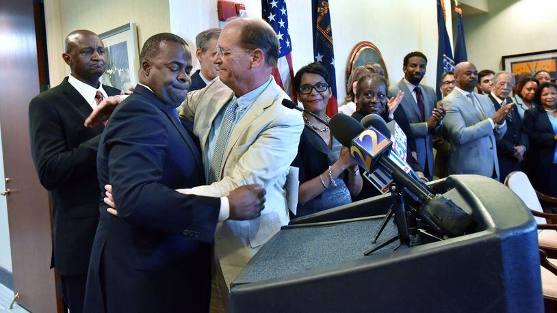 Atlanta Mayor Kasim Reed and Richard Anderson, CEO of Delta Air Lines, get emotional in April before they sign a new lease deal that will keep Delta’s headquarters at Atlanta’s airport for the next two decades. HYOSUB SHIN / HSHIN@AJC.COM