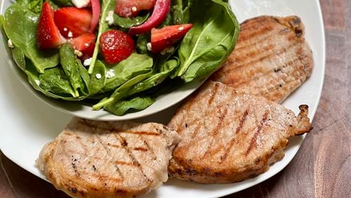 Brined, grilled pork chops are the ultimate easy, delicious summer meal.
Kellie Hynes for The Atlanta Journal-Constitution