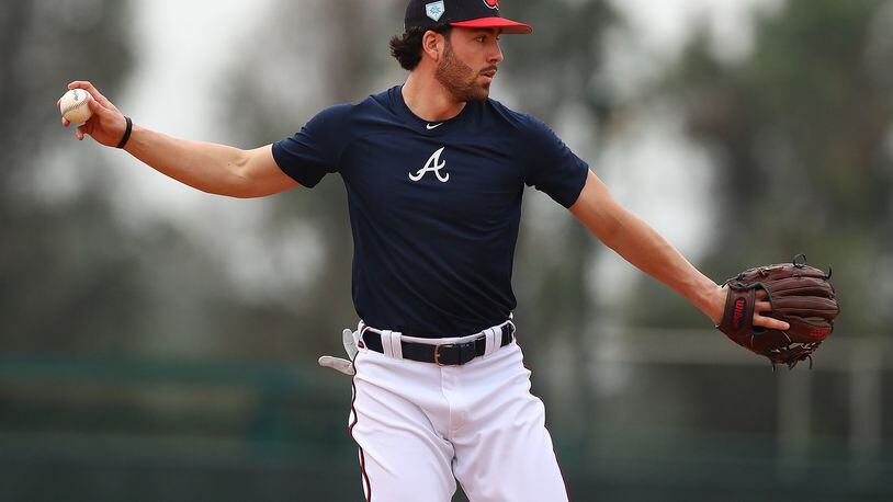 Dansby Swanson prepares to throw after fielding a ground ball. (Curtis Compton/ccompton@ajc.com)