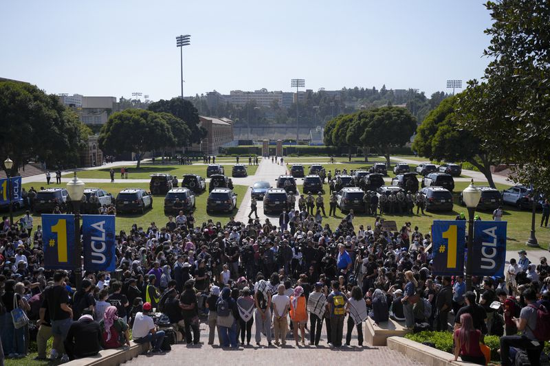 Demonstrators hold a press briefing on the UCLA campus, after nighttime clashes between Pro-Israel and Pro-Palestinian groups, Wednesday, May 1, 2024, in Los Angeles. (AP Photo/Jae C. Hong)