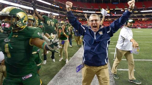Atlanta, Ga. -- Grayson head coach Jeff Herron (center) reacts to a point scored late in the second half by the Rams during their Class AAAAAAA state title game at the Georgia Dome Saturday, December 10, 2016. SPECIAL/Daniel Varnado