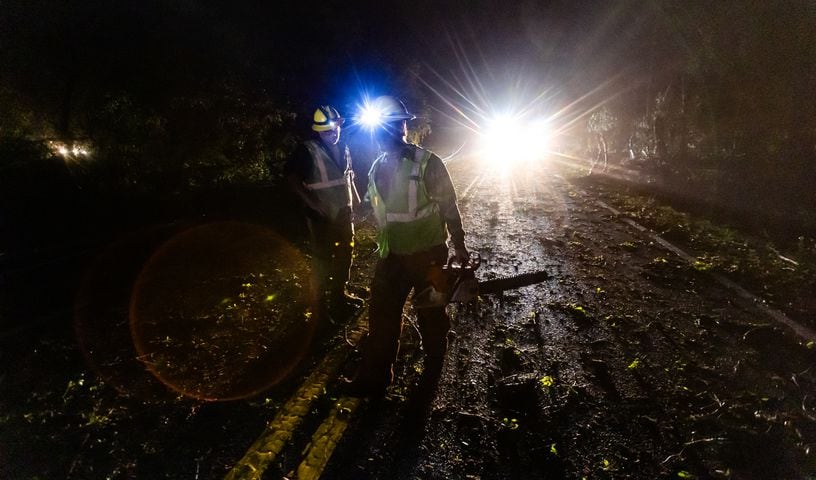 Power crews were hard at at work on McDaniel Mill Road early Wednesday morning, April 3, 2024, dealing with severe storm damage in Rockdale County. (John Spink / John.Spink@ajc.com)