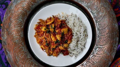 Chicken tikka masala with a side of caraway-spiced rice