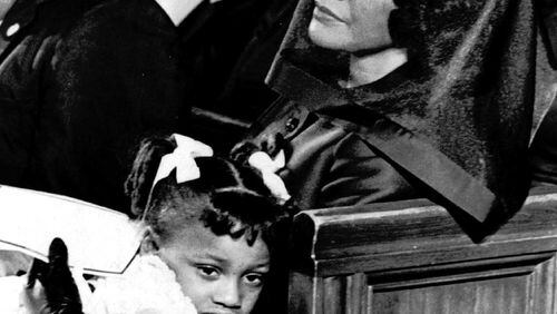 Coretta Scott King and her daughter Bernice, 5, are shown April 9, 1968, attending the funeral of her husband, Dr. Martin Luther King, Jr., in Atlanta, in this Pulitzer-prize winning file photograph taken by Moneta J. Sleet, Jr., the first African-American to win a Pulitzer Prize for photography. (AP Photo/Moneta J. Sleet, Jr.)
