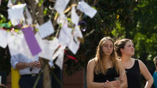 Mourners wrote notes and attached them to a tree at a memorial for Georgia Tech student Scout Schultz Sunday, September 17, 2017, In Atlanta GA. Schultz, an engineering student at Georgia Tech, was shot by Georgia Tech campus police near Curran Parking Deck after allegedly wielding a knife and telling officers to shoot him Saturday night. STEVE SCHAEFER / SPECIAL TO THE AJC