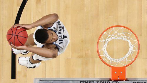 Omari Spellman #14 of the Villanova Wildcats goes up for a dunk in the second half against the Kansas Jayhawks during the 2018 NCAA Men's Final Four Semifinal at the Alamodome on March 31, 2018 in San Antonio, Texas.  (Photo by Ronald Martinez/Getty Images)