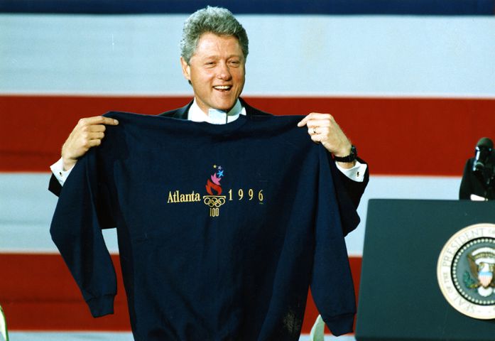President Bill Clinton displays an Atlanta 1996 Olympic sweatshirt (size XXL) that Atlanta Mayor Bill Campbell presented to him at a Clinton rally at CNN Center in Atlanta Tuesday, May 3, 1994. 
MANDATORY CREDIT: DIANE LAAKSO / THE ATLANTA JOURNAL-CONSTITUTION