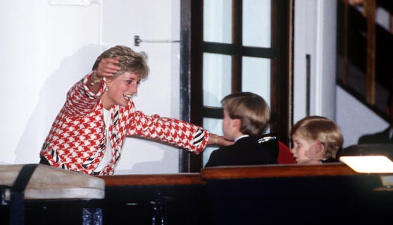 The Princess of Wales greets her sons Prince William and Prince Harry on the deck of the yacht Britannia in Toronto, when they joined their parents on an official visit to Canada on October 23, 1991. 