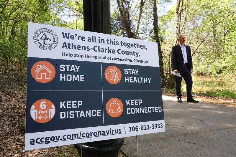 Athens Mayor Kelly Girtz films one of his public service video addresses by the North Oconee River in Dudley Park to encourage and inform Athens residents on April 2, 2020. Athens, Georgia, had a mandatory shelter-in-place order in effect long before many metro Atlanta towns took similar steps. (CURTIS COMPTON / ccompton@ajc.com)