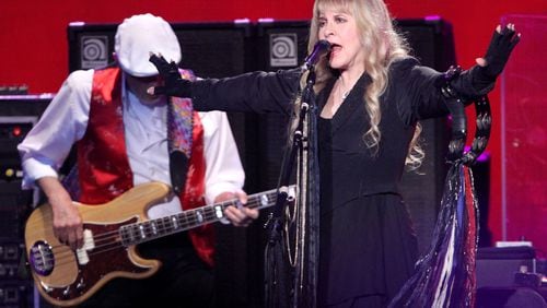 #1 of #22. PLEASE KEEP IN SEQUENTIAL ORDER FOR THE CONTINUITY OF THE GALLERY. Iconic rockers Fleetwood Mac brought their On With the Show tour to an energized and sold out Philips Arena Wednesday night, December 17, 2014. Touring with Christine McVie for the first time in 16 years, Stevie Nicks (pictured), Mick Fleetwood, Lindsey Buckingham and John McVie looked and sounded in exceptional form. Robb D. Cohen/RobbsPhotos.com Stevie Nicks - shown at the December Philips Arena show - still likes that outfit. Photo: Robb D. Cohen/RobbsPhotos.com.