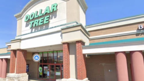 A woman was arrested at a Roswell Dollar Tree store on Tuesday after officers found two of her children locked inside a hot car, according to police.