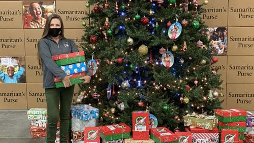 Marika Chasse of Johns Creek helps out at the Southeast distribution site for Samaritan's Purse Operation Christmas Child. More than 2.1 million shoeboxes filled with gifts will be sent to children throughout the world from this location. (Courtesy of Samaritan's Purse Operation Christmas Child)
