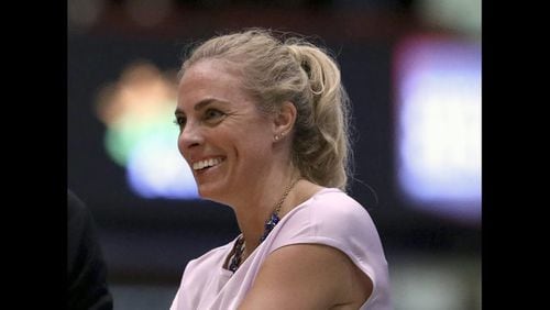 Atlanta Dream head coach Nicki Collen smiles during a WNBA basketball game against the New York Liberty. (AP Photo/Gregory Payan, File)