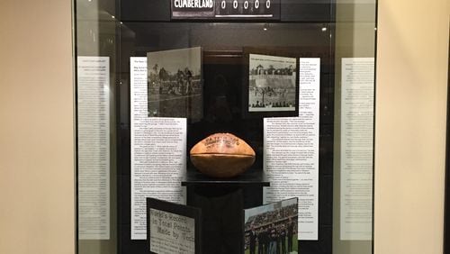 The game ball from Georgia Tech's 222-0 win over Cumberland in 1916 in its display case at the Edge Center. (GTAA)