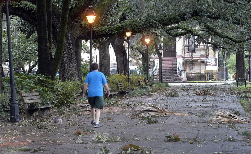 A man walks through Forsyth Park in Savannah after Hurricane Dorian.