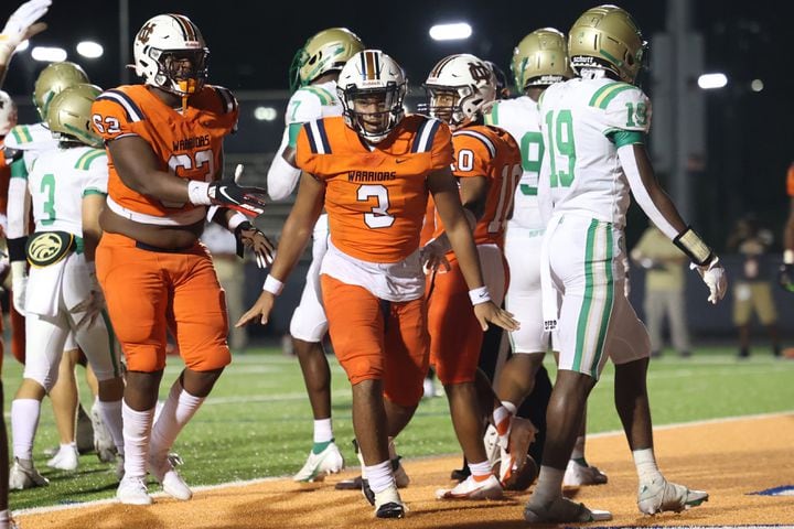 August 20, 2021 - Kennesaw, Ga: North Cobb quarterback Malachi Singleton (3) celebrates his rushing touchdown during the first half against Buford at North Cobb high school Friday, August 20, 2021 in Kennesaw, Ga.. JASON GETZ FOR THE ATLANTA JOURNAL-CONSTITUTION