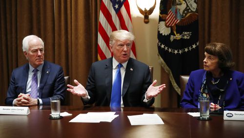 President Donald Trump speaks in the Cabinet Room of the White House, in Washington, Wednesday, Feb. 28, 2018, during a meeting with members of Congress to discuss school and community safety. (AP Photo/Carolyn Kaster)