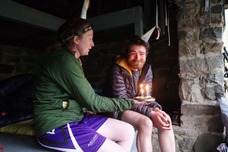 Henry “Fonzie” Wilber helps Michael “Bender” Harkness celebrate his birthday with a special treat at a shelter on the Appalachian Trail. Wilber, Harkness and three other companions all met on the trail and coalesced into an impromptu family. They are currently in Pennsylvania, still hiking north. CONTRIBUTED BY HENRY WILBER