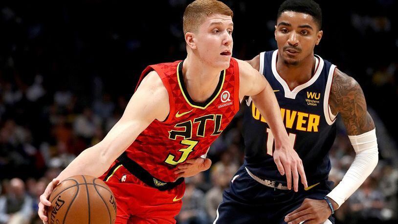 Kevin Huerter of the Atlanta Hawks drives against Gary Harris of the Denver Nuggets at the Pepsi Center on November 12, 2019 in Denver, Colorado. (Photo by Matthew Stockman/Getty Images)