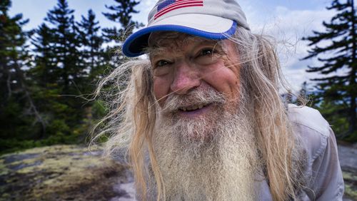 M.J. Eberhart, 83, arrives on the summit of Mount Hayes on the Appalachian Trail in Gorham, New Hampshire. Eberhart, who goes by the trail name of Nimblewill Nomad, is the oldest person to hike the entire 2,193-mile Appalachian Trail. (AP Photo/Robert F. Bukaty)
