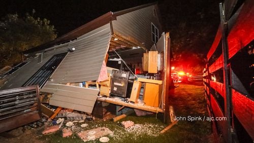 A train derailed and knocked a house off its foundation in northwest Atlanta.