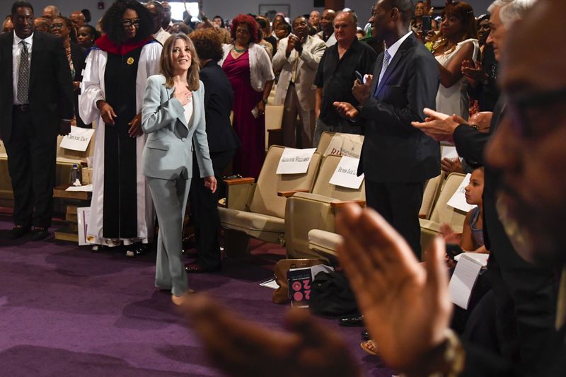 Democratic presidential candidate and author Marianne Williamson reacts to applause after delivering the sermon and before signing books at Hillside International Truth Center in Atlanta. Williamson is among a crowded field of Democratic candidates vying for the nation’s top job. 