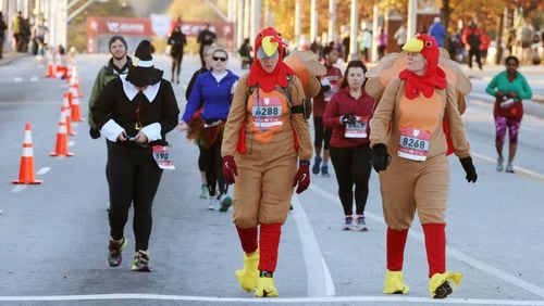 In a file photo, he Atlanta Track Club’s Thanksgiving Day Half Marathon &amp; 5K takes participants on a 13.1 mile tour through the heart of Atlanta.
