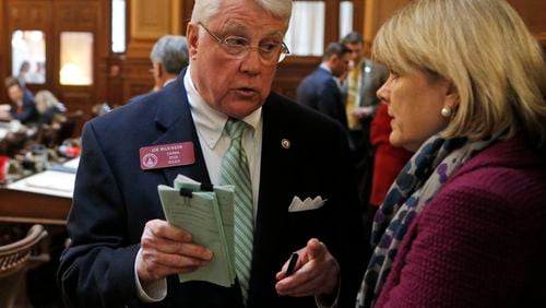State Rep. Joe Wilkinson, R - Atlanta, confers with Rep. Beth Beskin, R - Atlanta, early in this year’s session. Bob Andres, bandres@ajc.com