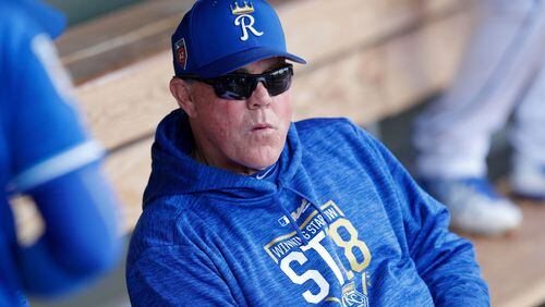 Kansas City Royals manager Ned Yost sits in the dugout before a spring training baseball game against the Cincinnati Reds, Wednesday, Feb. 28, 2018, in Surprise, Ariz. (AP Photo/Charlie Neibergall) ORG XMIT: AZCN1