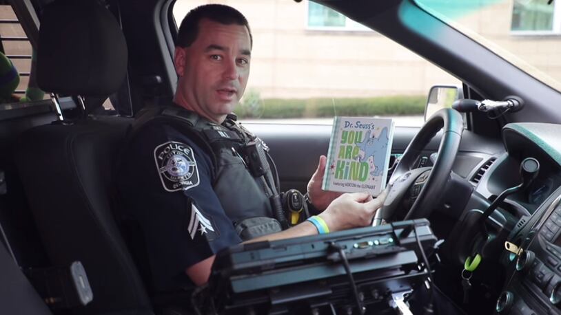 Marietta school resource officer Paul Hill was filmed reading Dr. Seuss' "You Are Kind" from his patrol vehicle.