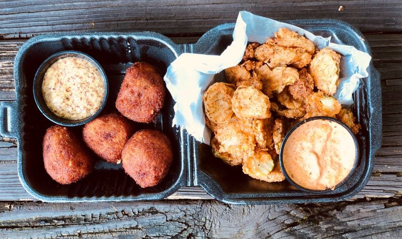 The Po’boy Shop’s boudin balls come with a mustard sauce, and the fried pickles come with remoulade. Both are great $5 snacks. CONTRIBUTED BY WENDELL BROCK
