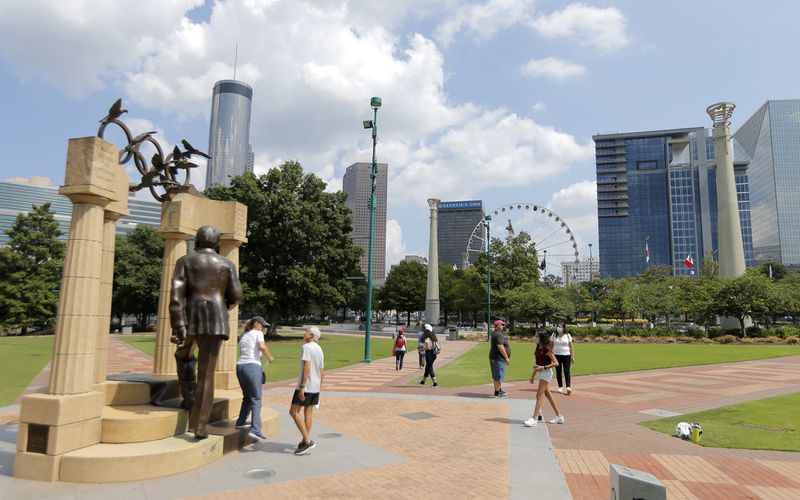 The skyline of downtown Atlanta is visible from Centennial Olympic Park, including the Skyview Atlanta wheel, just right of center. (Christine Tannous / christine.tannous@ajc.com)
