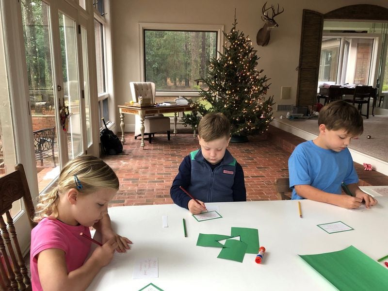 Winter break gives parents the opportunity to spend quality time with their children while teaching them how to serve and give back to their community. Here, the children are writing holiday “thank you” cards for their local fire department. CONTRIBUTED BY COURTNEY TETTERTON