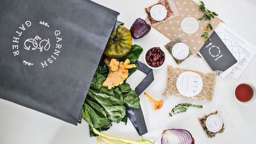 A Garnish & Gather meal kit comes in a reusable grocery bag with prepared and portion ingredients, a recipe card and a "table topic" card. (Photo credit: Heidi Geldhauser)