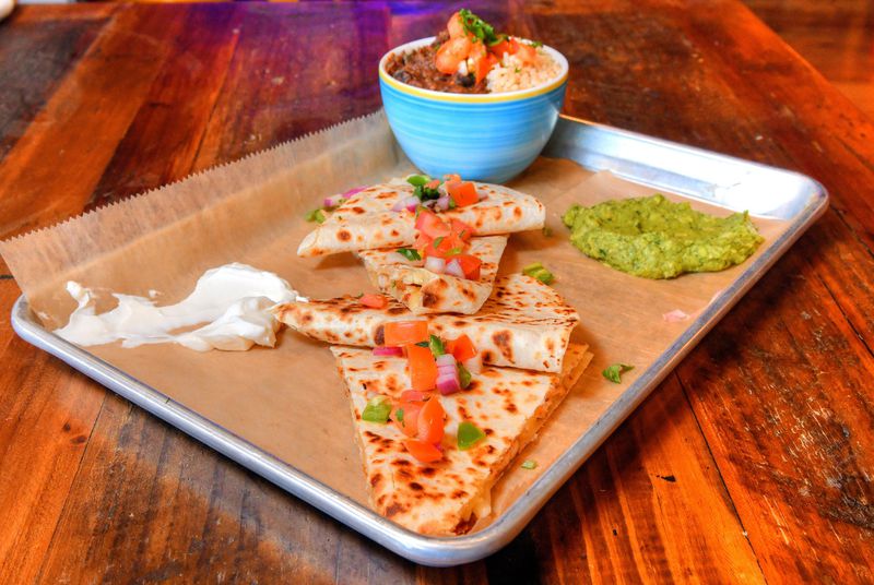 Chicken Quesadillas, served with rice and beans, guacamole and pico de gallo. CONTRIBUTED BY CHRIS HUNT PHOTOGRAPHY