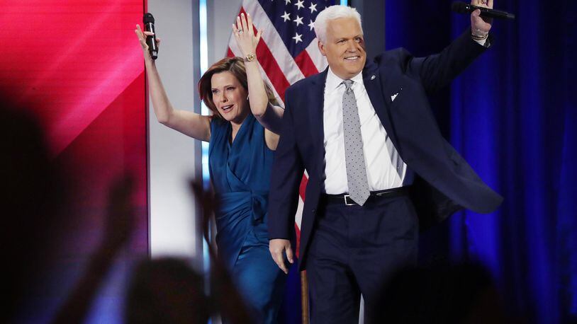 Mercedes and Matt Schlapp walk onstage to a cheering crowd during CPAC at the Hyatt Regency in Orlando, Florida, in February. A former aide to the U.S. Senate campaign of Herschel Walker has accused Matt Schlapp of sexually harassing him. (Stephen M. Dowell/Orlando Sentinel/TNS)