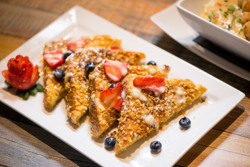 Gocha's Krunch-Tastic French Toast, crunchy battered french toast with fresh mixed berries and house vanilla bean sauce. Photo credit- Mia Yakel.
