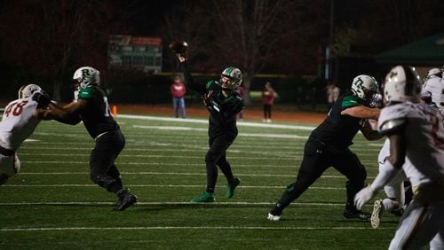 Robbie Roper, junior quarterback for Roswell, passes the ball during the Mill Creek vs. Roswell high school football game on Friday, November 27, 2020, at Roswell High School in Roswell, Georgia. Roswell defeated Mill Creek 28-27. CHRISTINA MATACOTTA FOR THE ATLANTA JOURNAL-CONSTITUTION