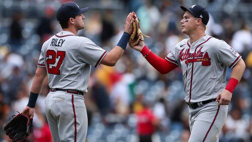 Braves third baseman Austin Riley (27) celebrates with teammate Joc Pederson after they defeated the San Diego Padres Sunday, Sept. 26, 2021, in San Diego. (Derrick Tuskan/AP)